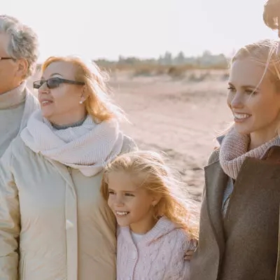 multigenerational family on the beach looking into the future